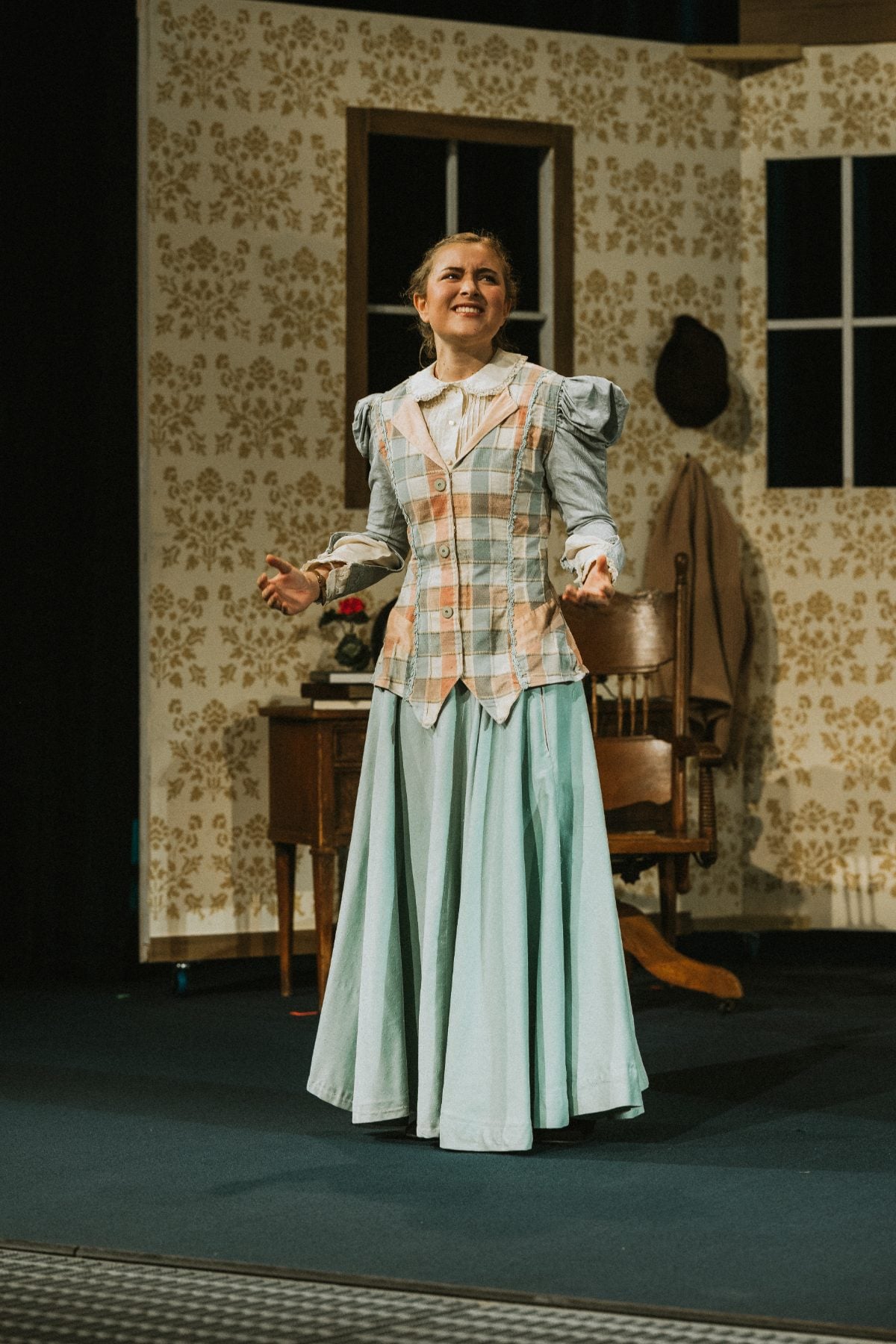 A student sings a solo number during the Christian school arts program production