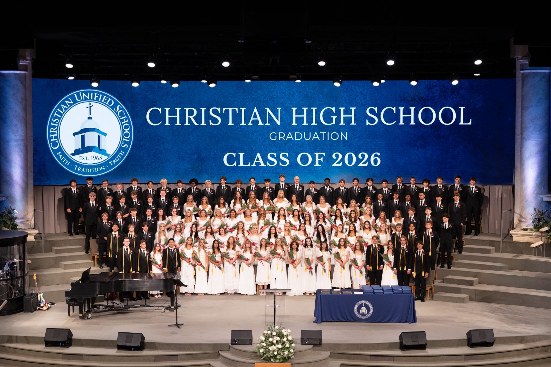 Christian High School Class of 2026 graduates pose together at Shadow Mountain Worship Center.
