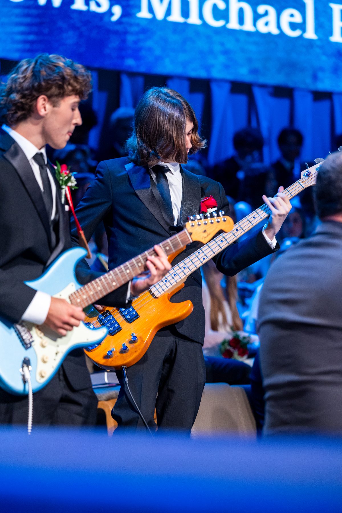 Two students play electric guitars during the graduation ceremony