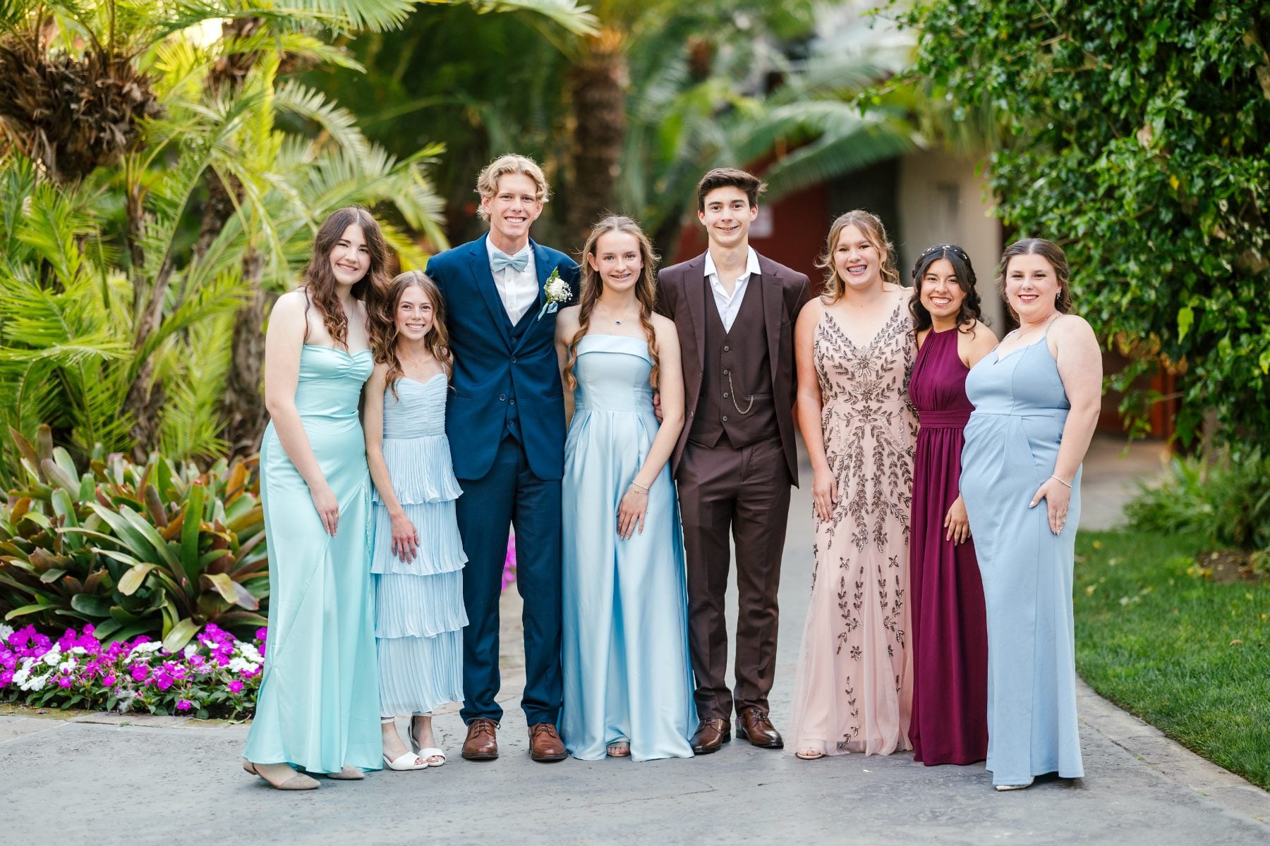 Group of eight students pose together at Catamaran Resort banquet