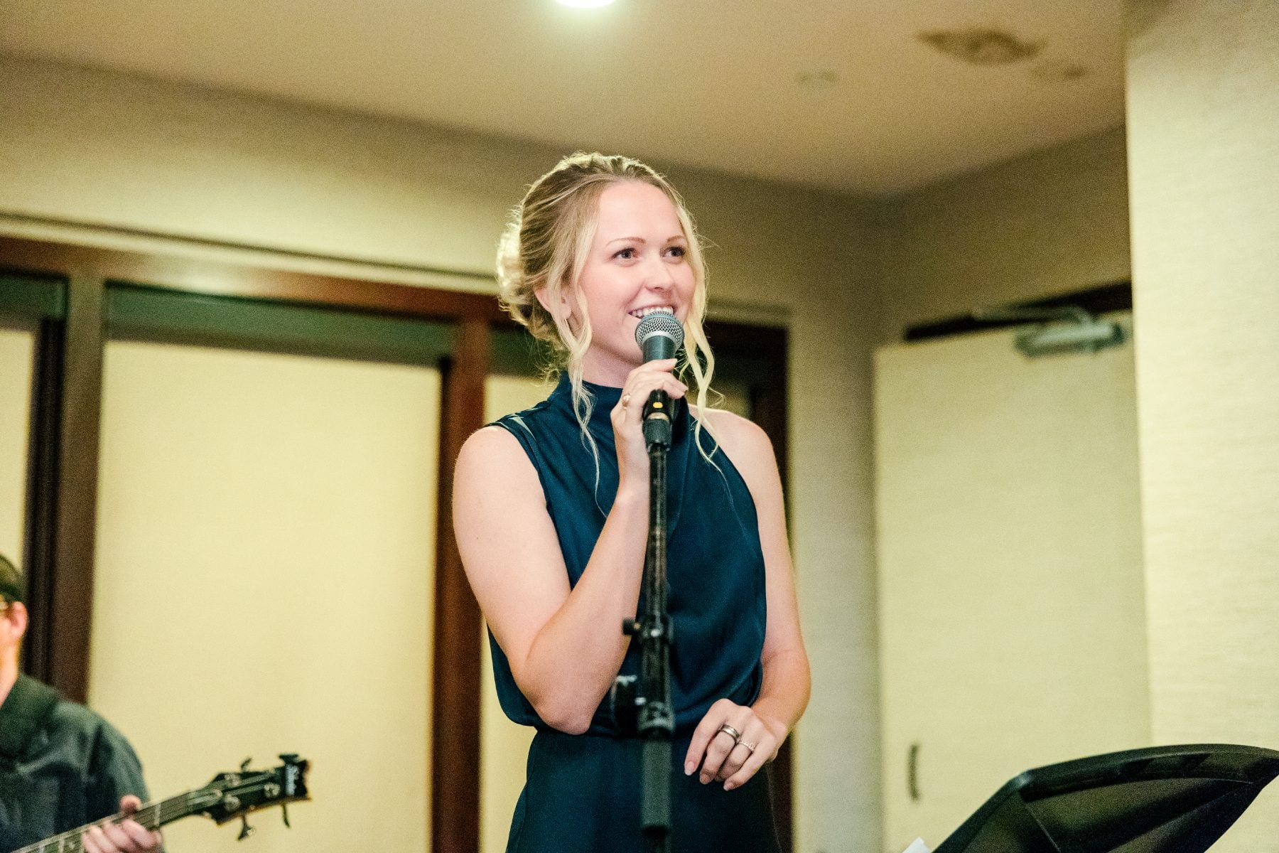 A vocalist sings with the band during the Jr/Sr Banquet