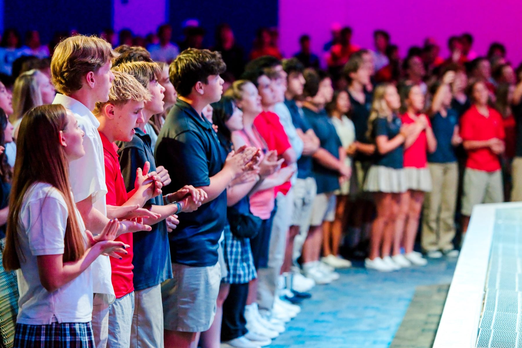 Students stand and applaud together during the Walk Worthy Chapel Kick-off