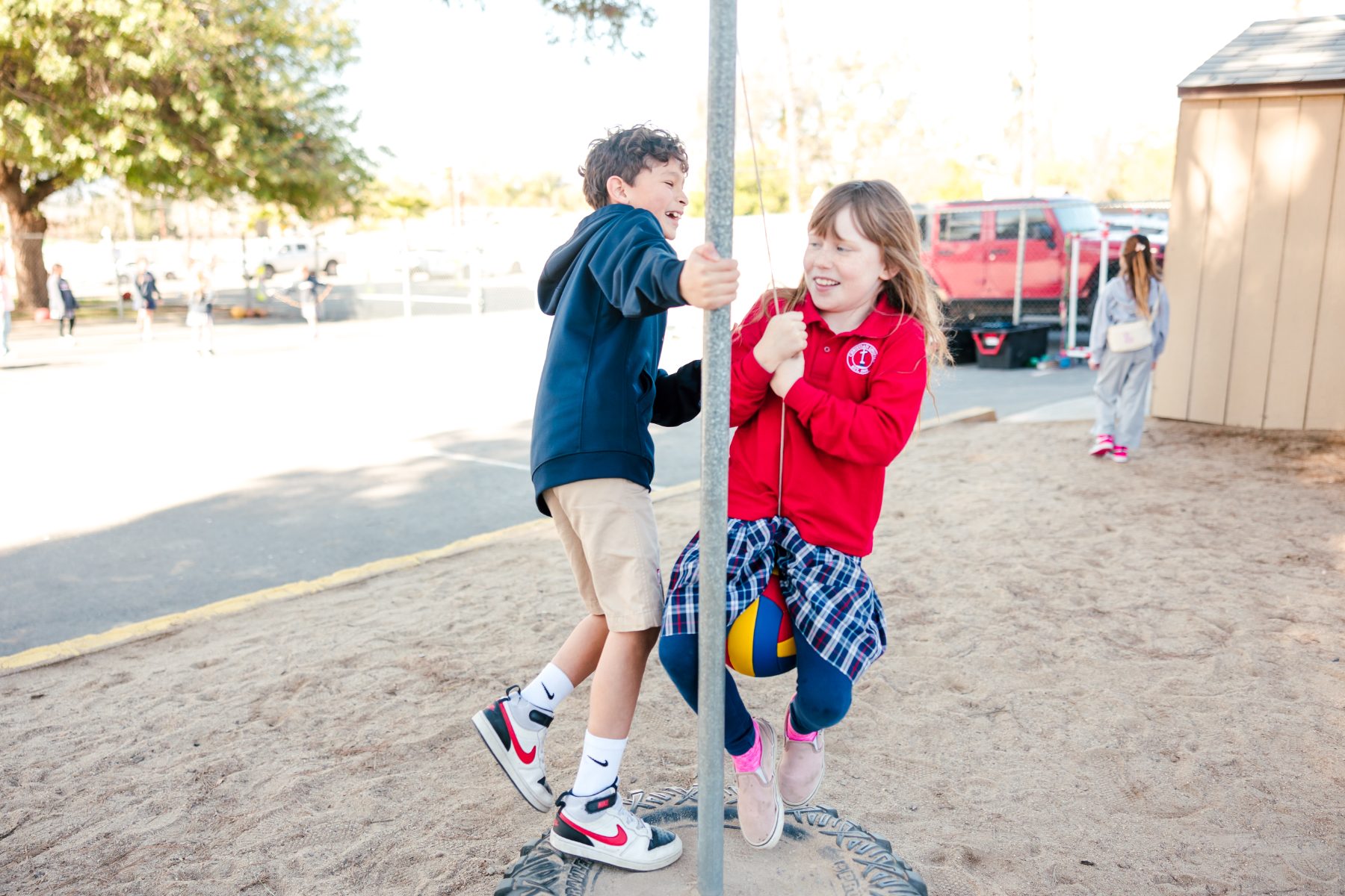 Two students play tetherball together at Christian Elementary School East campus