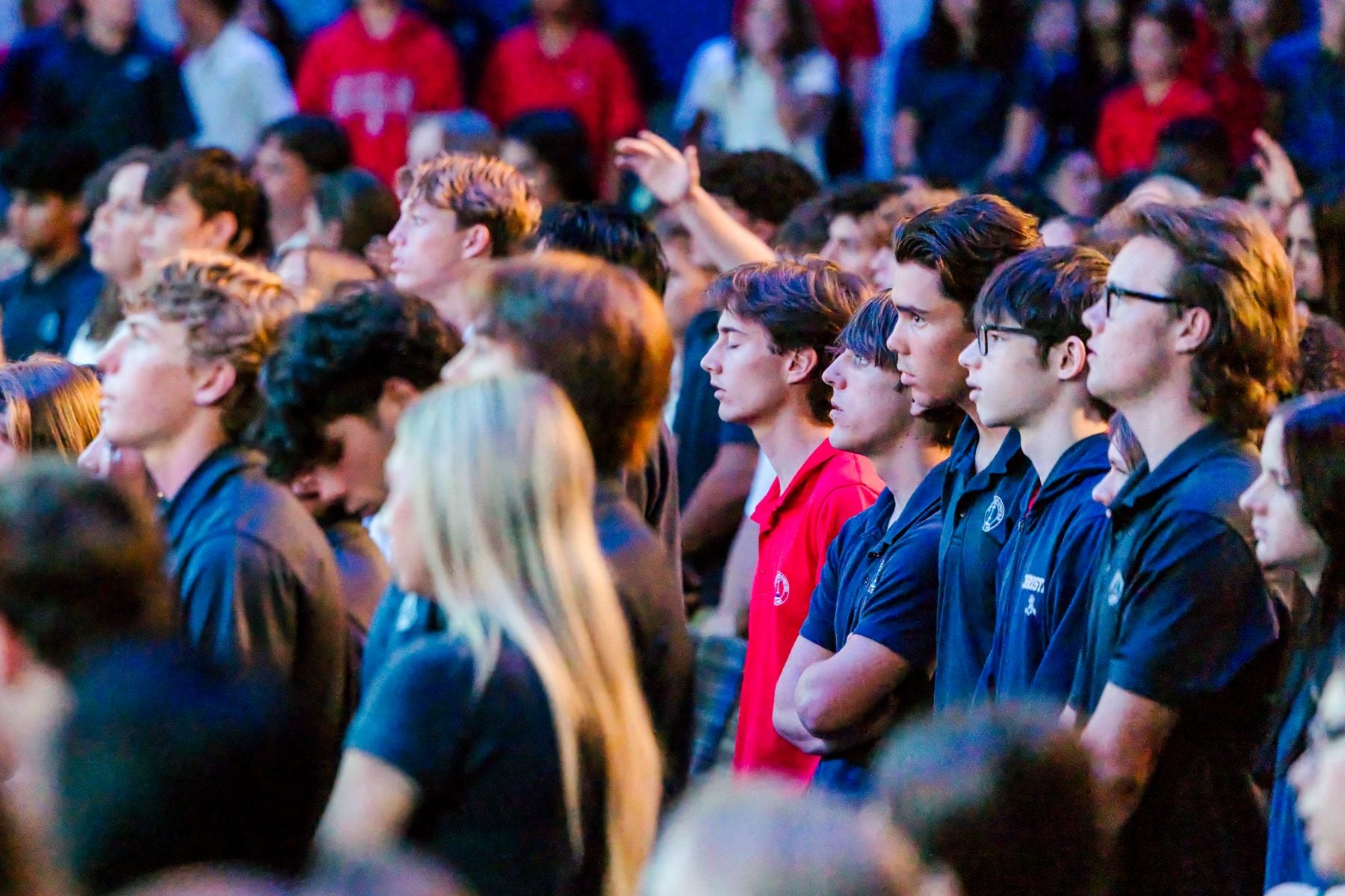 Students stand together worshipping during Walk Worthy chapel at Shadow Mountain