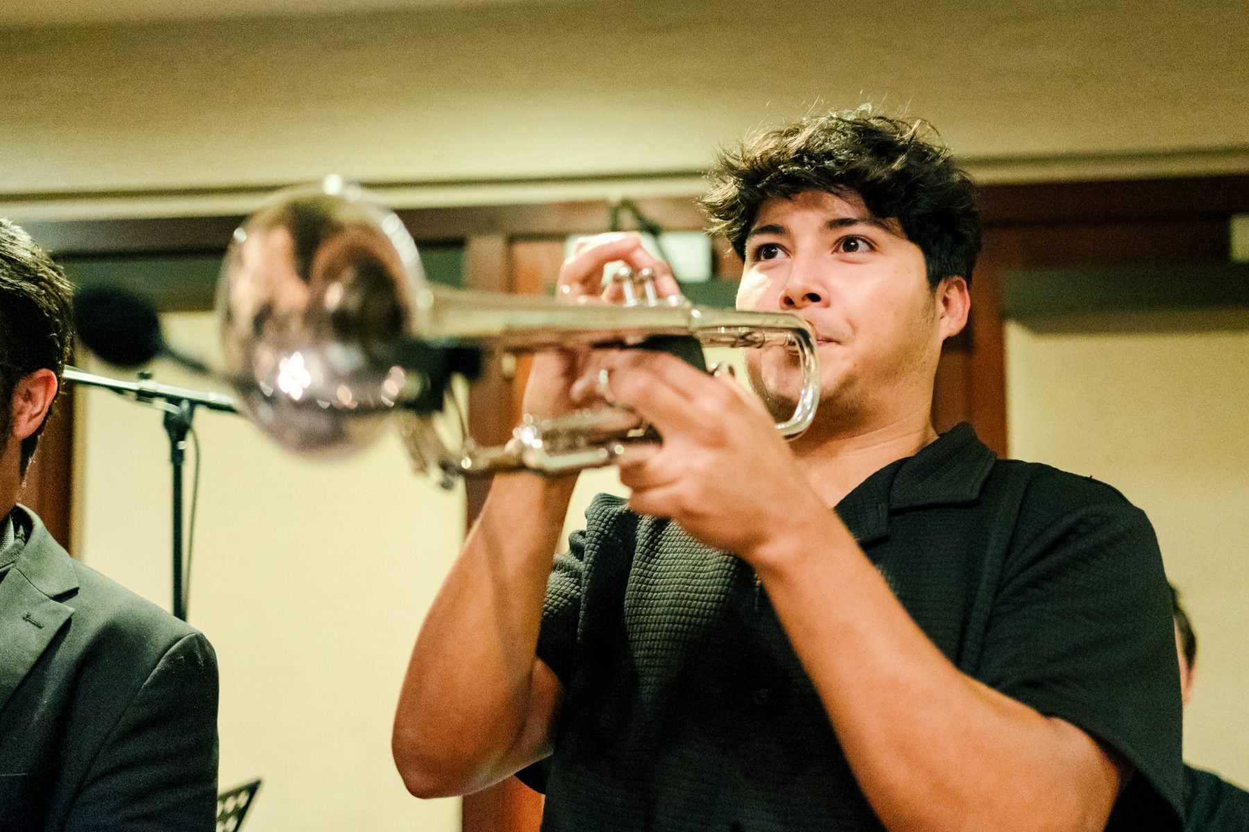 Musician plays trumpet with band at Jr/Sr Banquet, Catamaran Resort