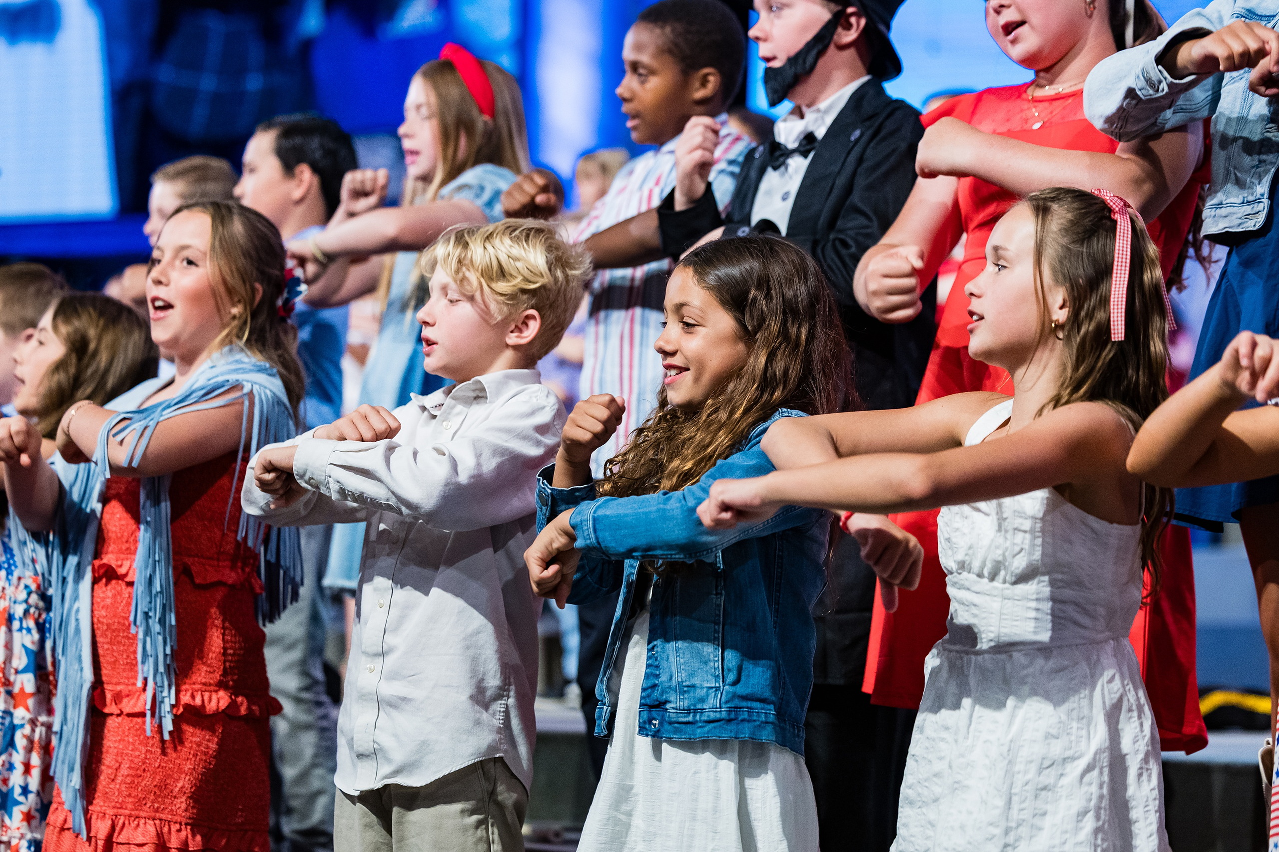 Christian Elementary East Celebrates Spring with “One Nation Under God” — 11 Students dancing and spinning with arms linked across the stage