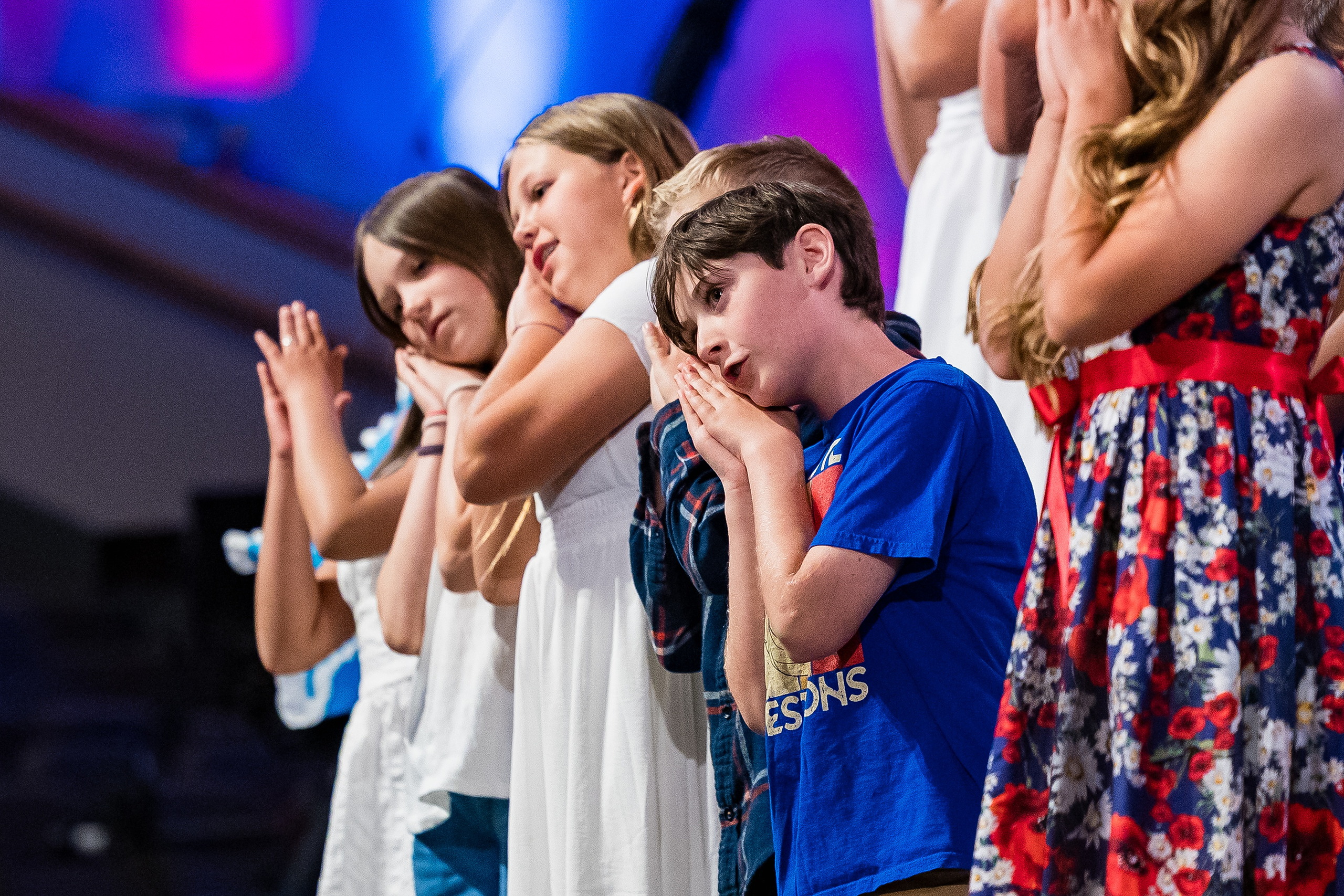 Christian Elementary East Celebrates Spring with “One Nation Under God” — 13 Close-up of elementary students singing with passionate expressions