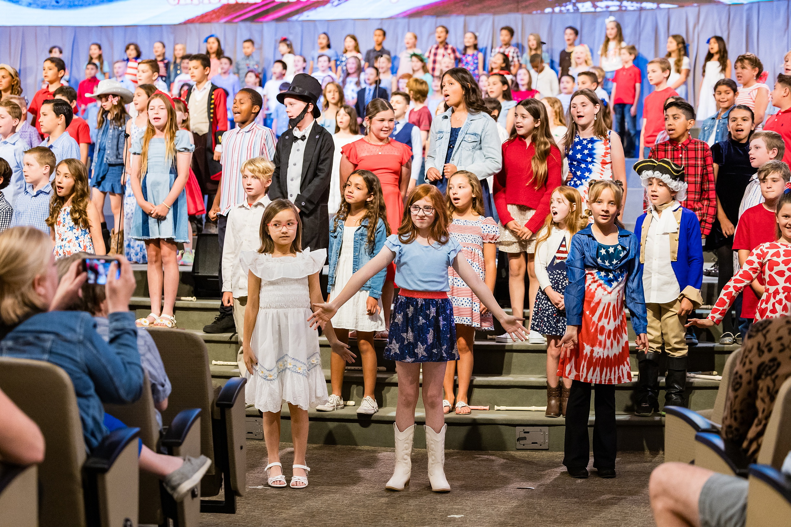 Christian Elementary East Celebrates Spring with “One Nation Under God” — 14 Large ensemble of all participating students standing on stage