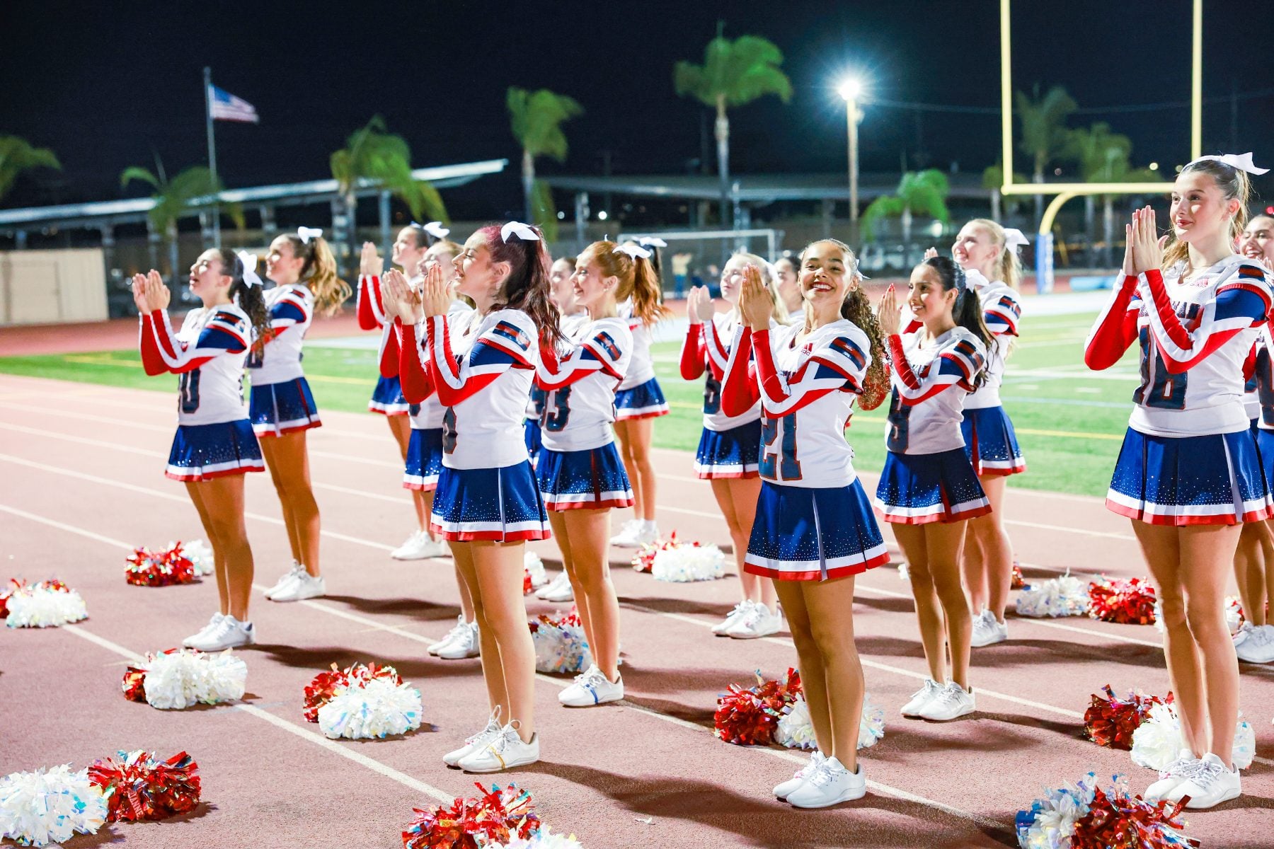 Christian High School cheerleaders cheer in formation during Homecoming night game