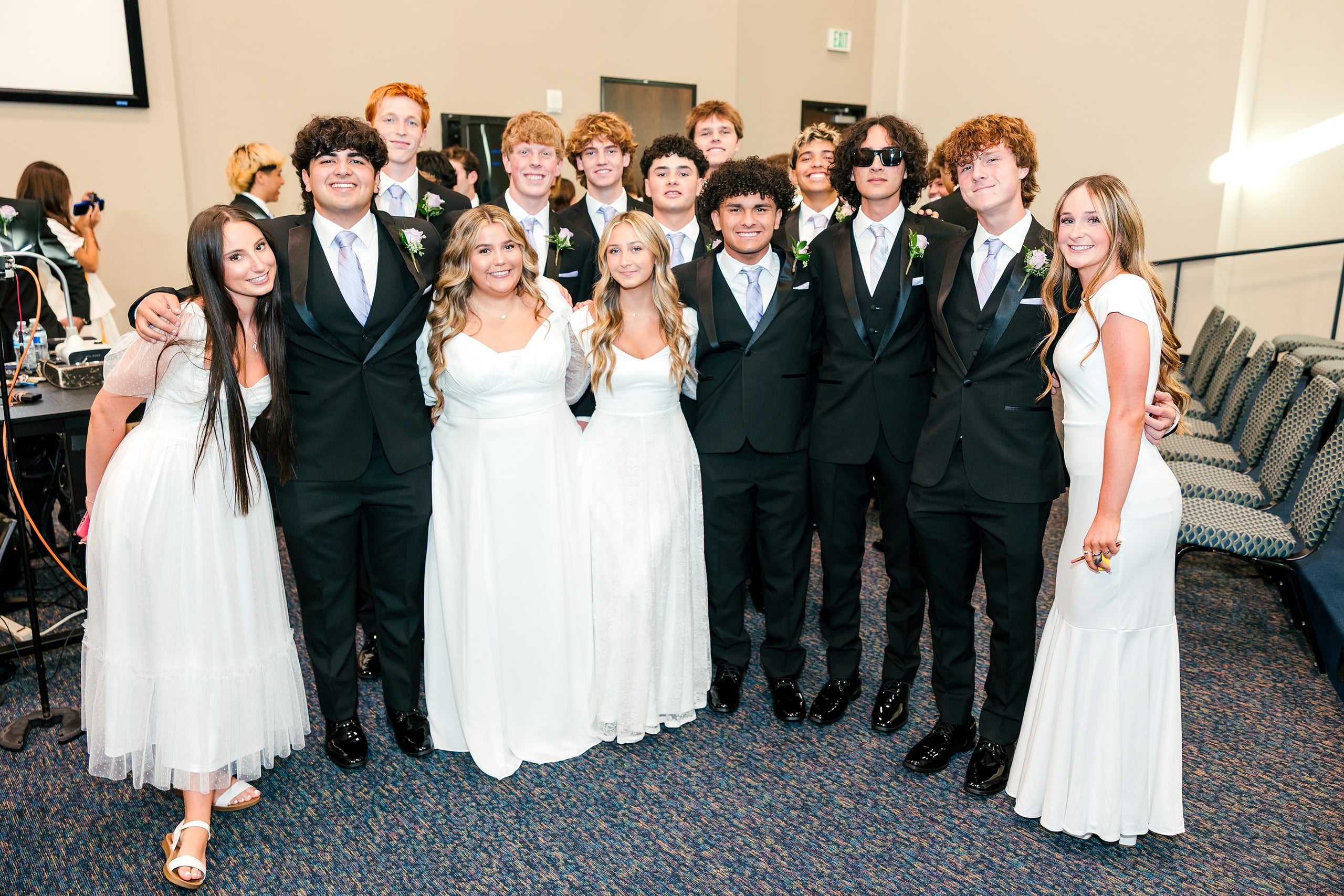 Christian High School Commencement 2025: Rise Up — 11 Graduates and faculty members gather on stage at Shadow Mountain Worship Center