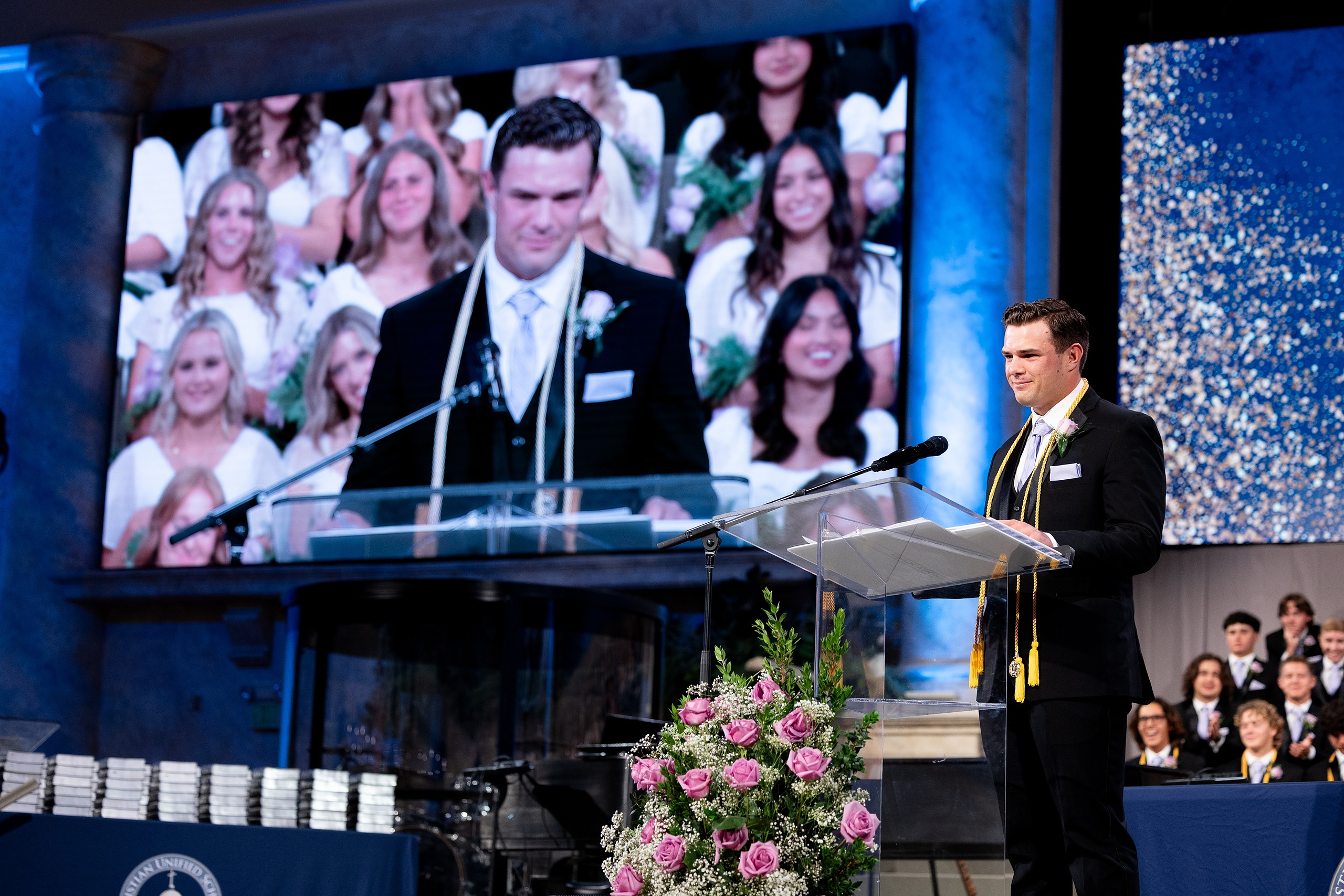 Christian High School Commencement 2025: Rise Up — 25 Valedictorian male graduate speaks at the podium during commencement
