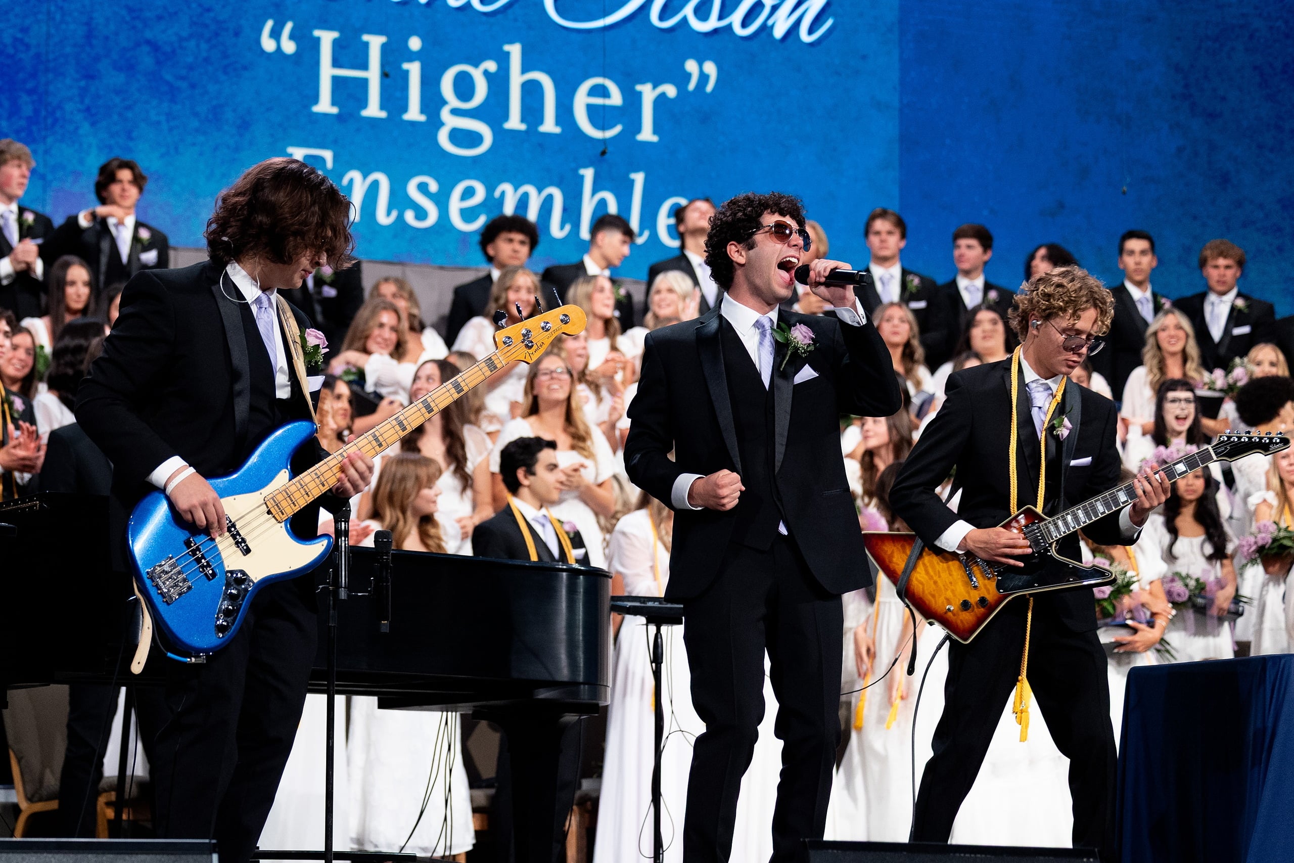 Christian High School Commencement 2025: Rise Up — 35 Students in band play rock song on stage with bass, vocals, and guitar