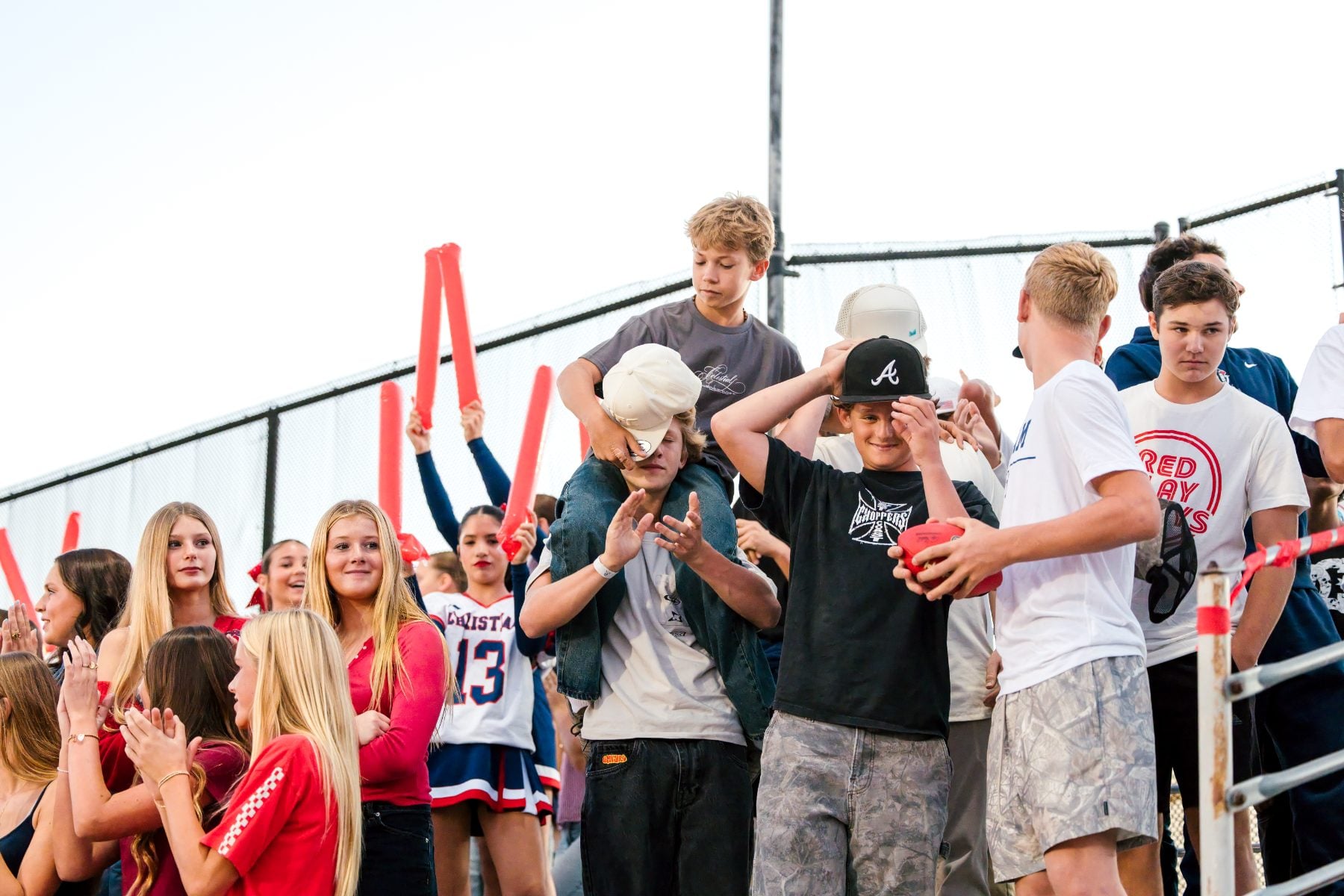 Christian High School students cheer together in the stands at homecoming