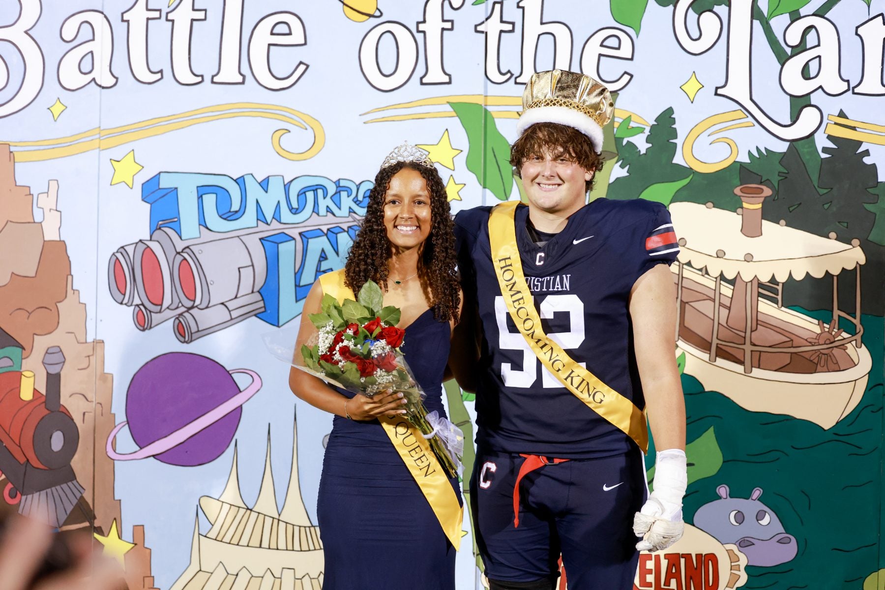 Homecoming king and queen pose crowned at Christian High School football game