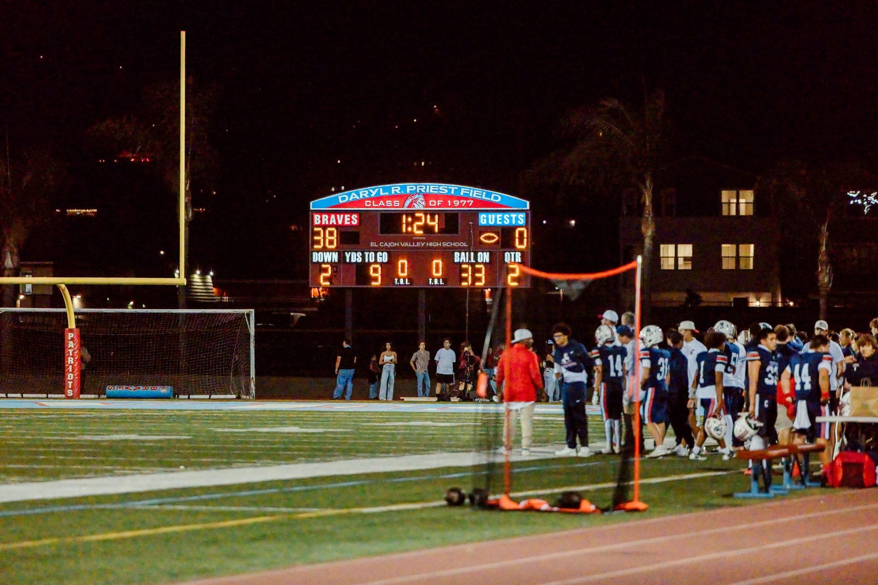 Scoreboard shows Patriots leading 38-0 during Homecoming night football game
