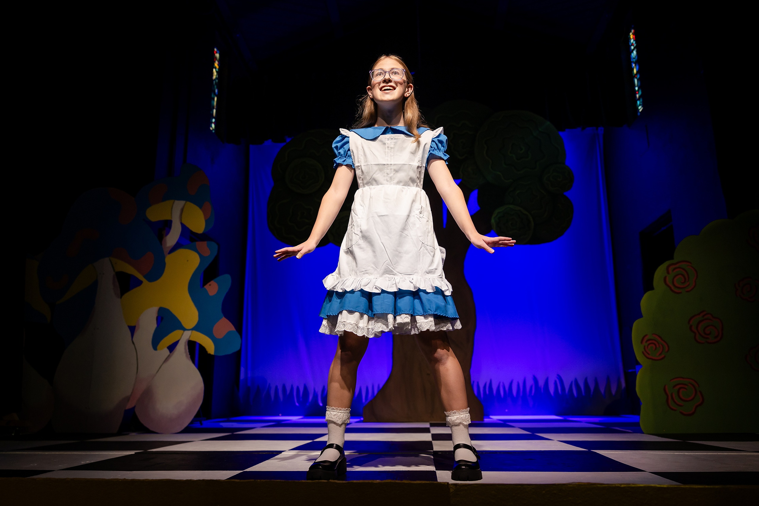 Curiouser and Curiouser! A Whimsical Journey with the Patriot Players — 11 Cast members perform Mad Hatter tea party scene with elaborate props
