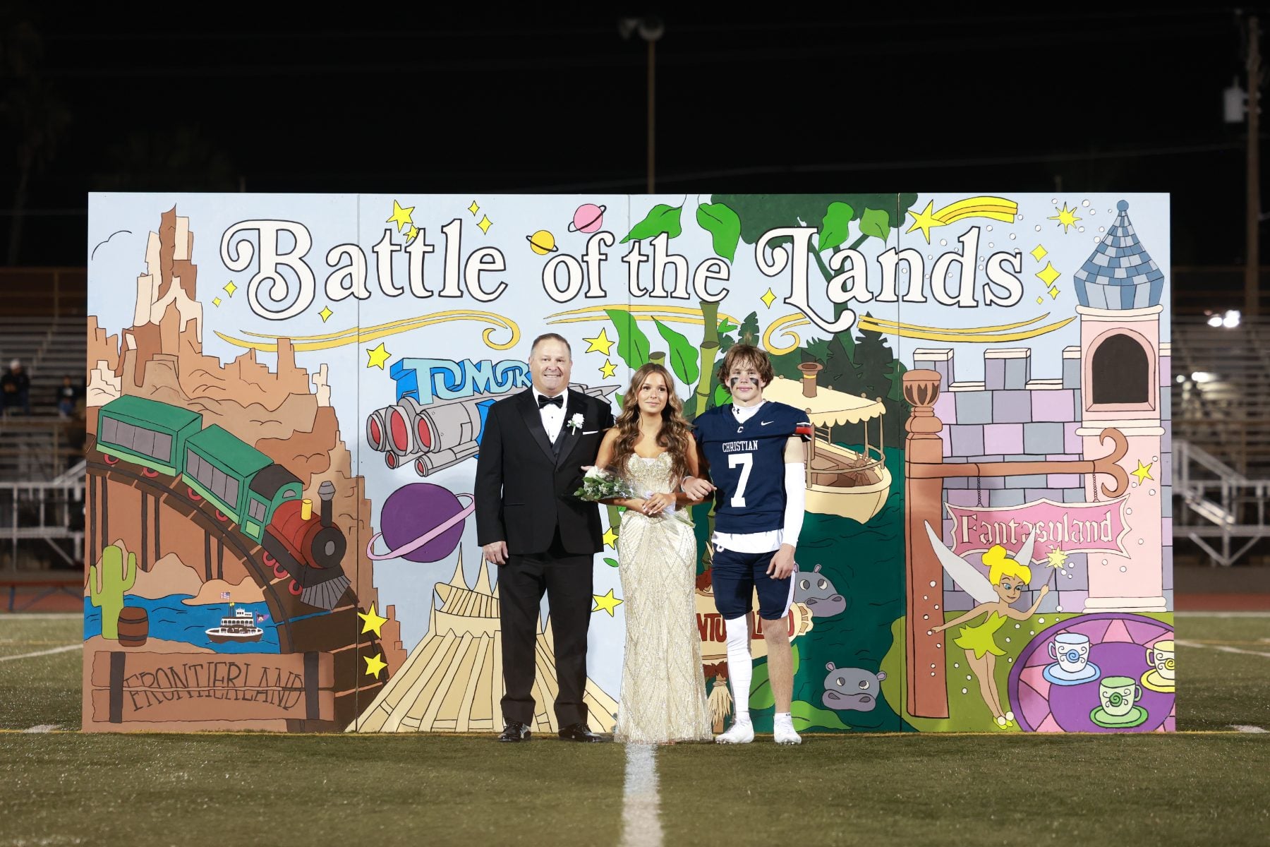 Homecoming court with player #7 poses on field at Christian High School