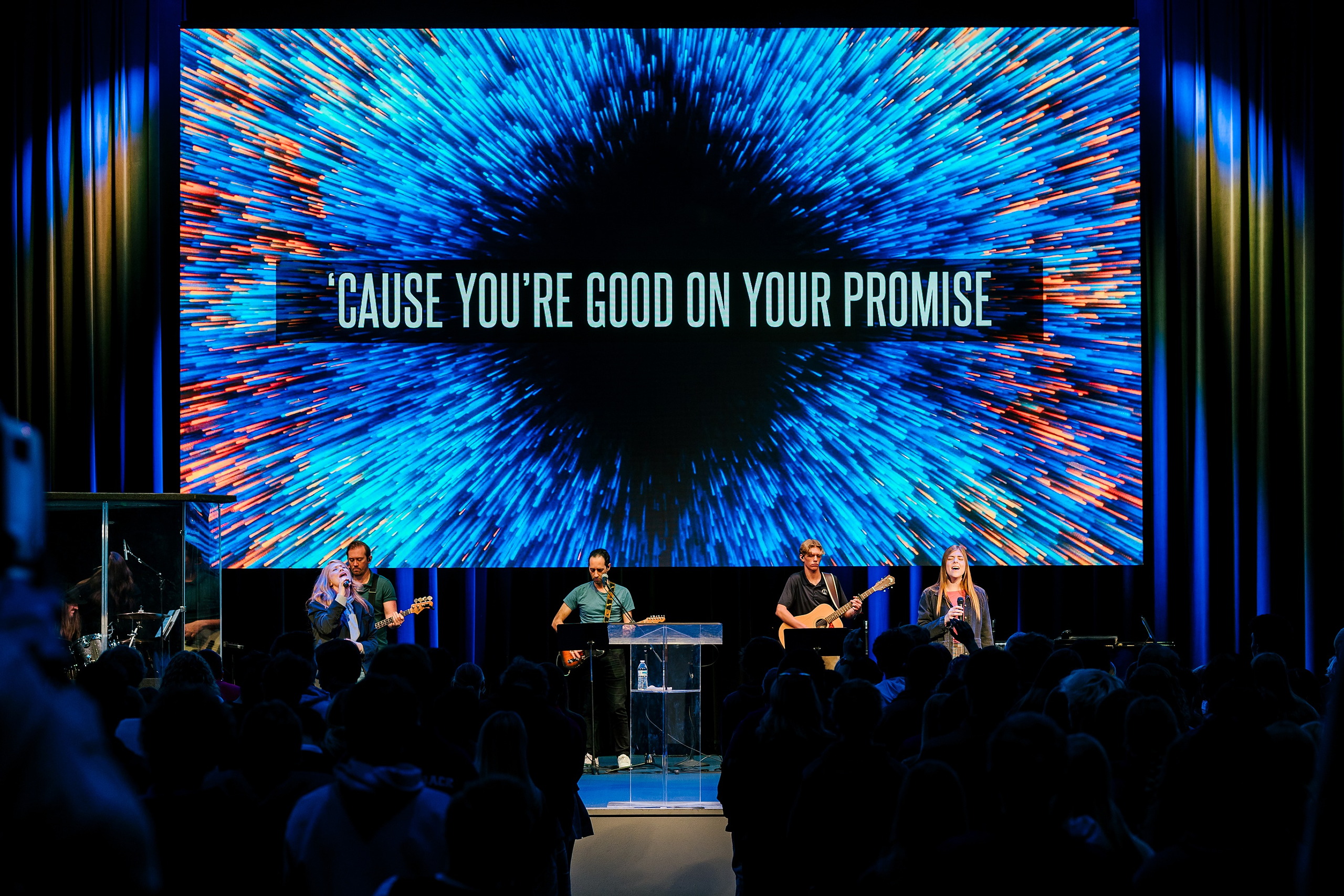 Spiritual Emphasis Week 2025 — 03 Worship band performs before large screen displaying event theme and messaging