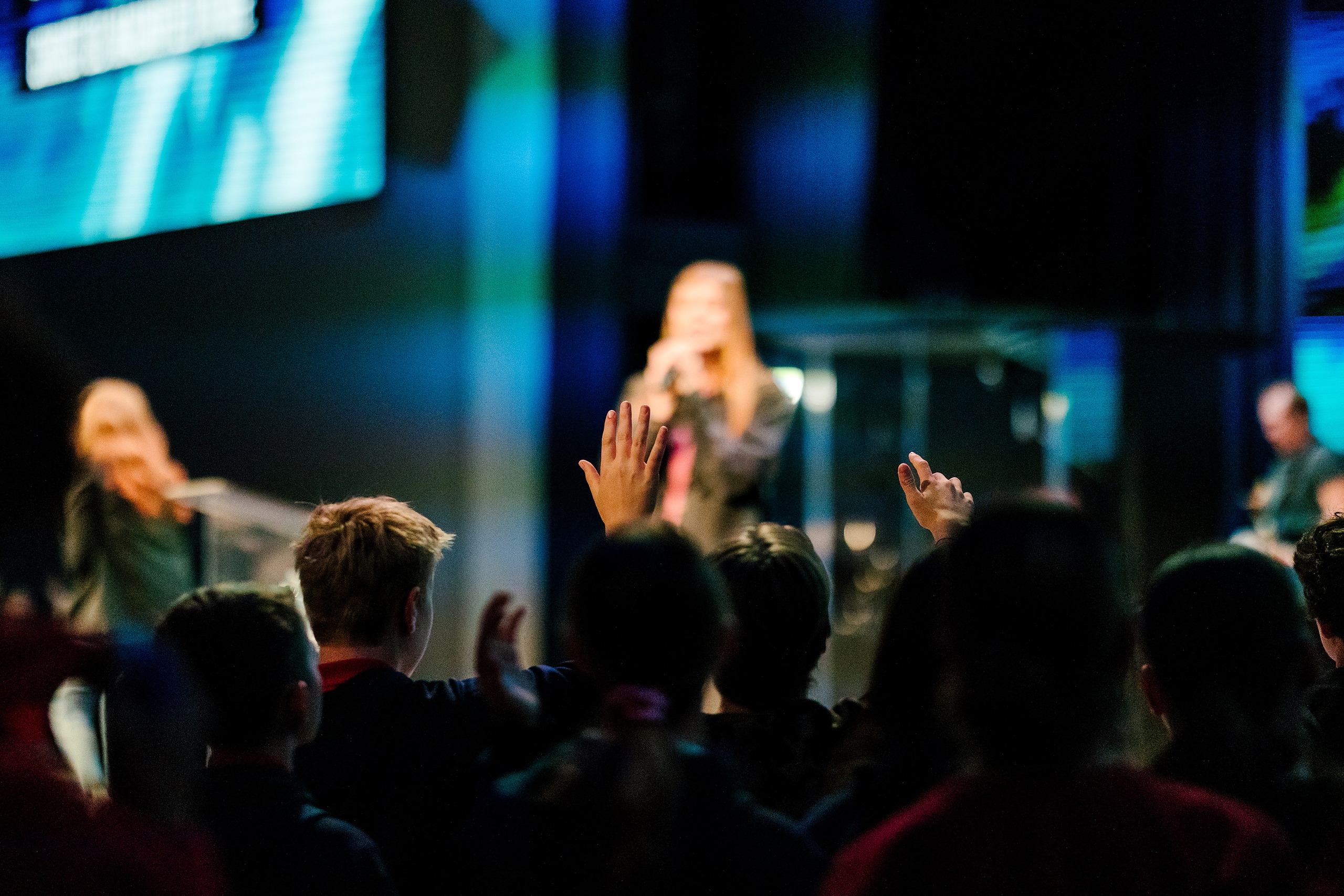 Spiritual Emphasis Week 2025 — 05 Teens with raised hands participate in worship at chapel event