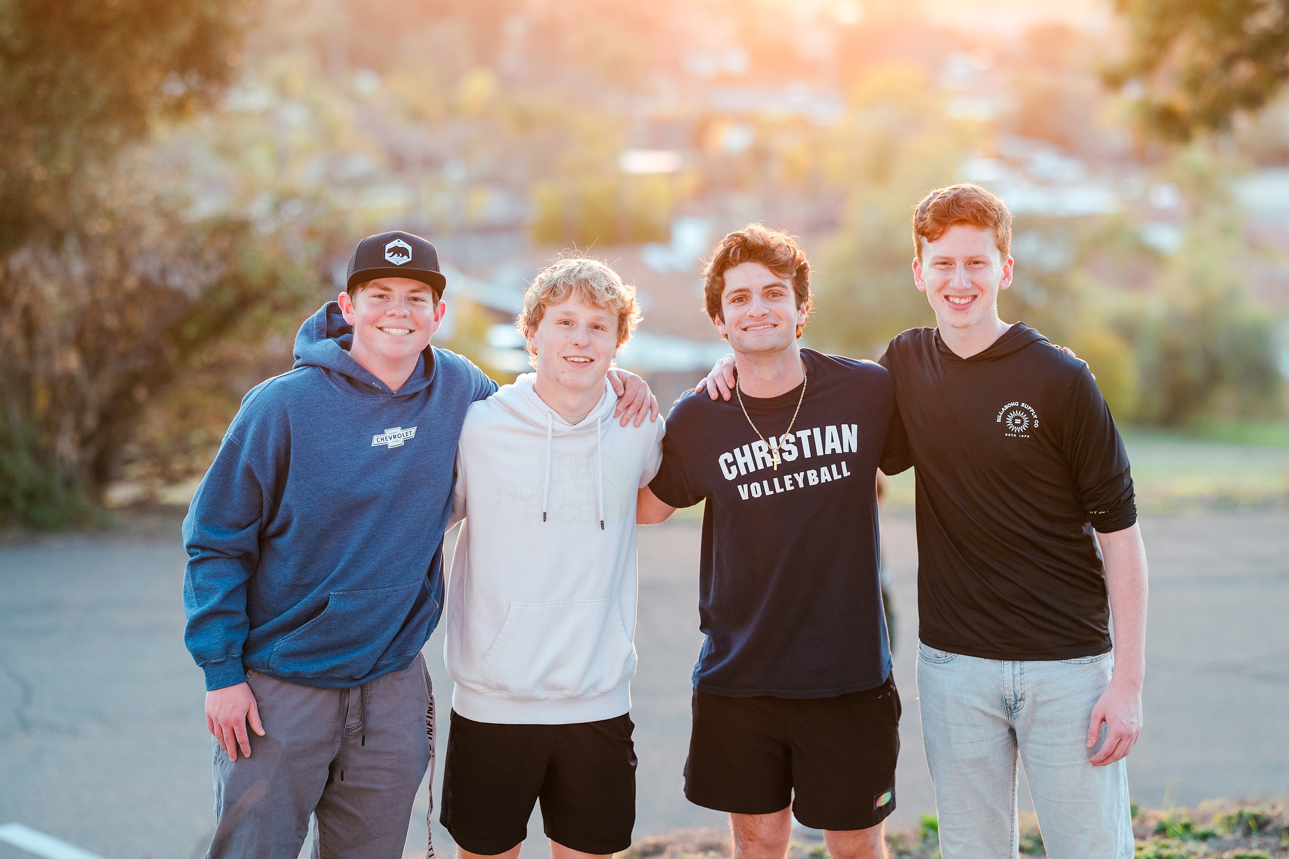 Spiritual Emphasis Week 2025 — 24 Four male students pose together with city view in background
