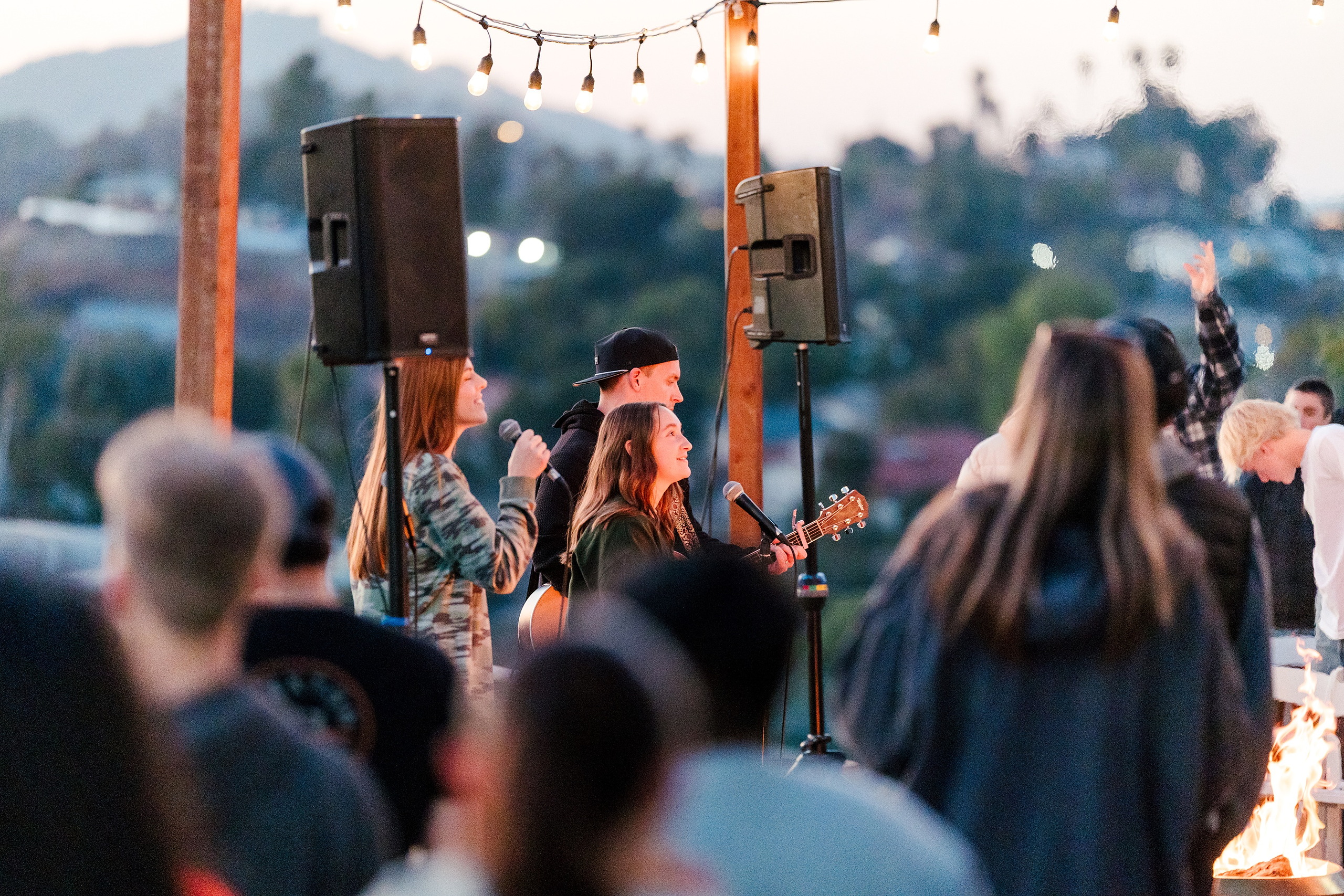 Spiritual Emphasis Week 2025 — 35 Worship musician plays guitar for students during evening outdoor event