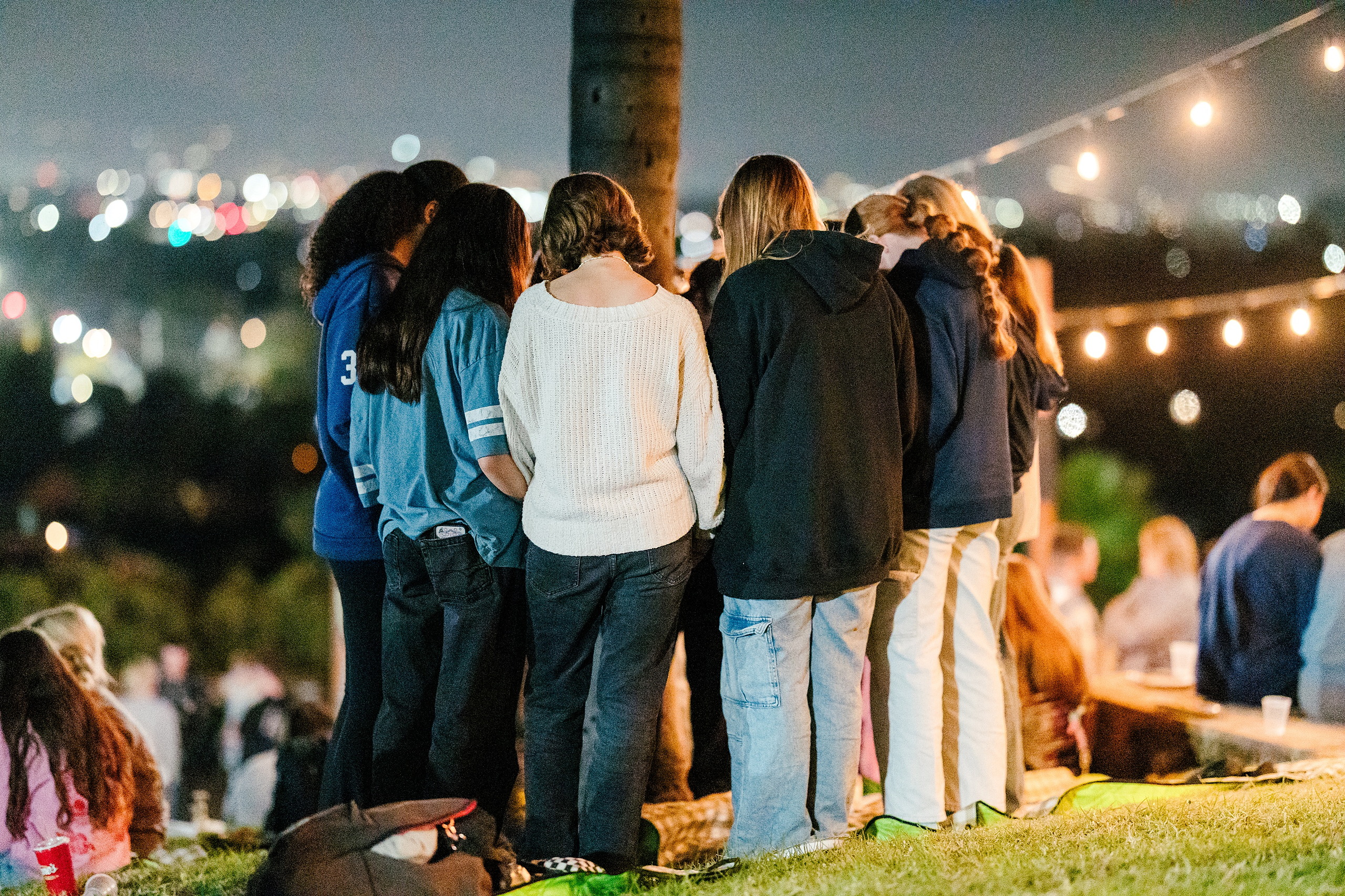 Spiritual Emphasis Week 2025 — 52 Group of female students gathered at outdoor evening worship event