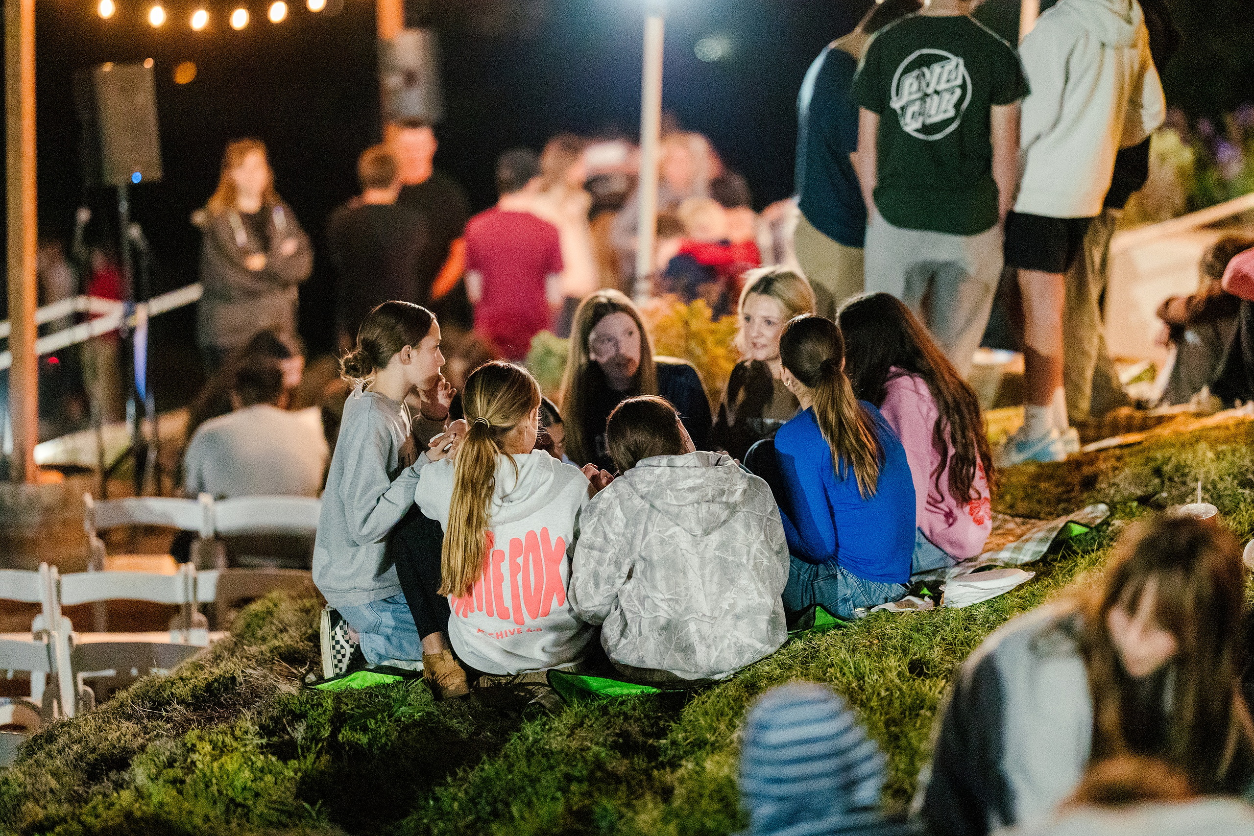 Spiritual Emphasis Week 2025 — 53 Students sit together during outdoor evening worship at Seminary