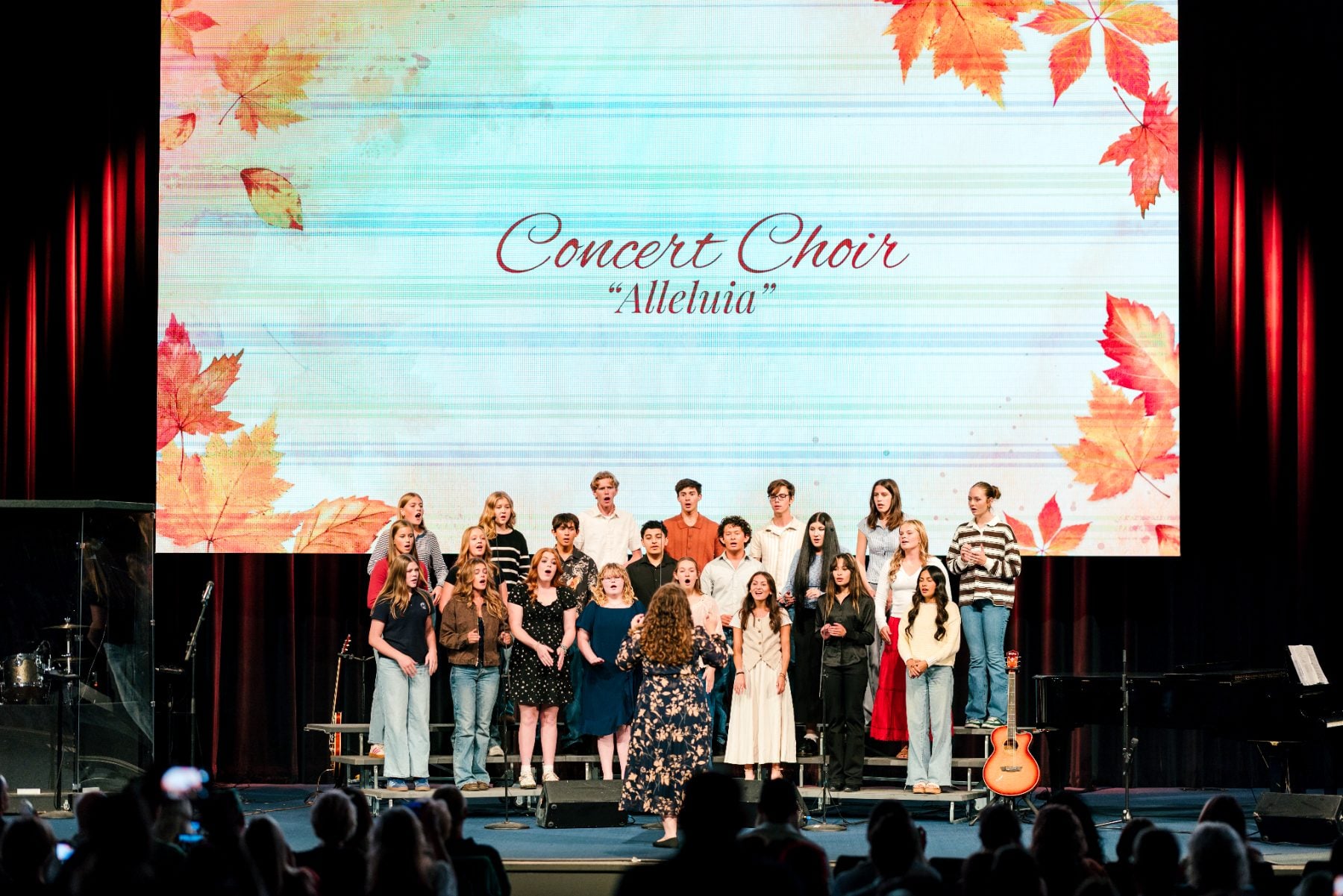 Concert Choir students sing "Alleluia" on stage at the Christian school event
