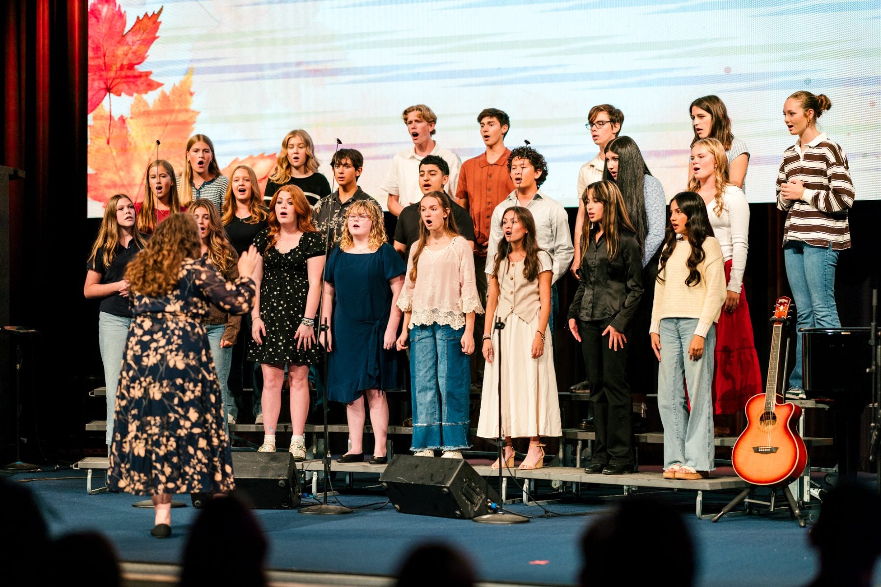 A full student choir performs together at the Fall Choral Concert.