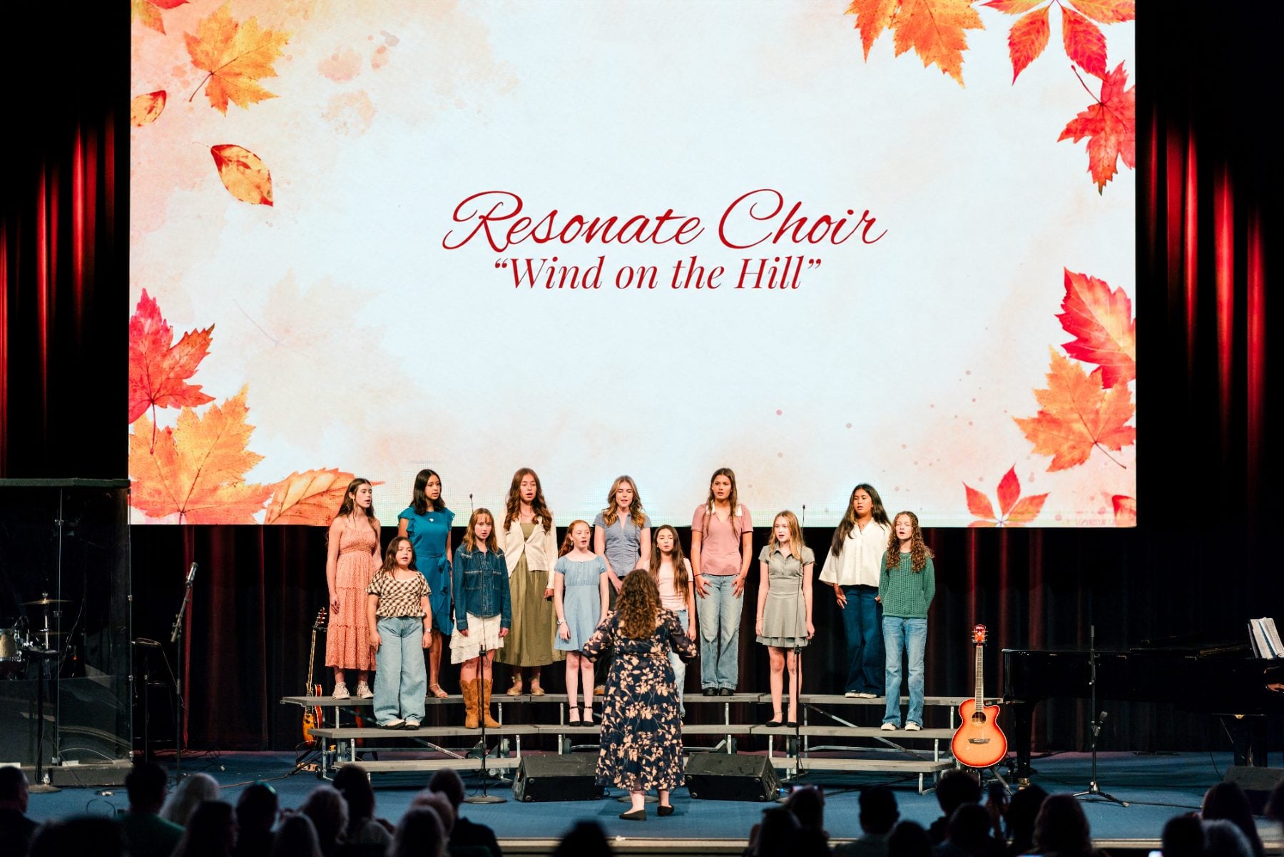Resonate Choir students sing "Wind on the Hill" at the Event Center.