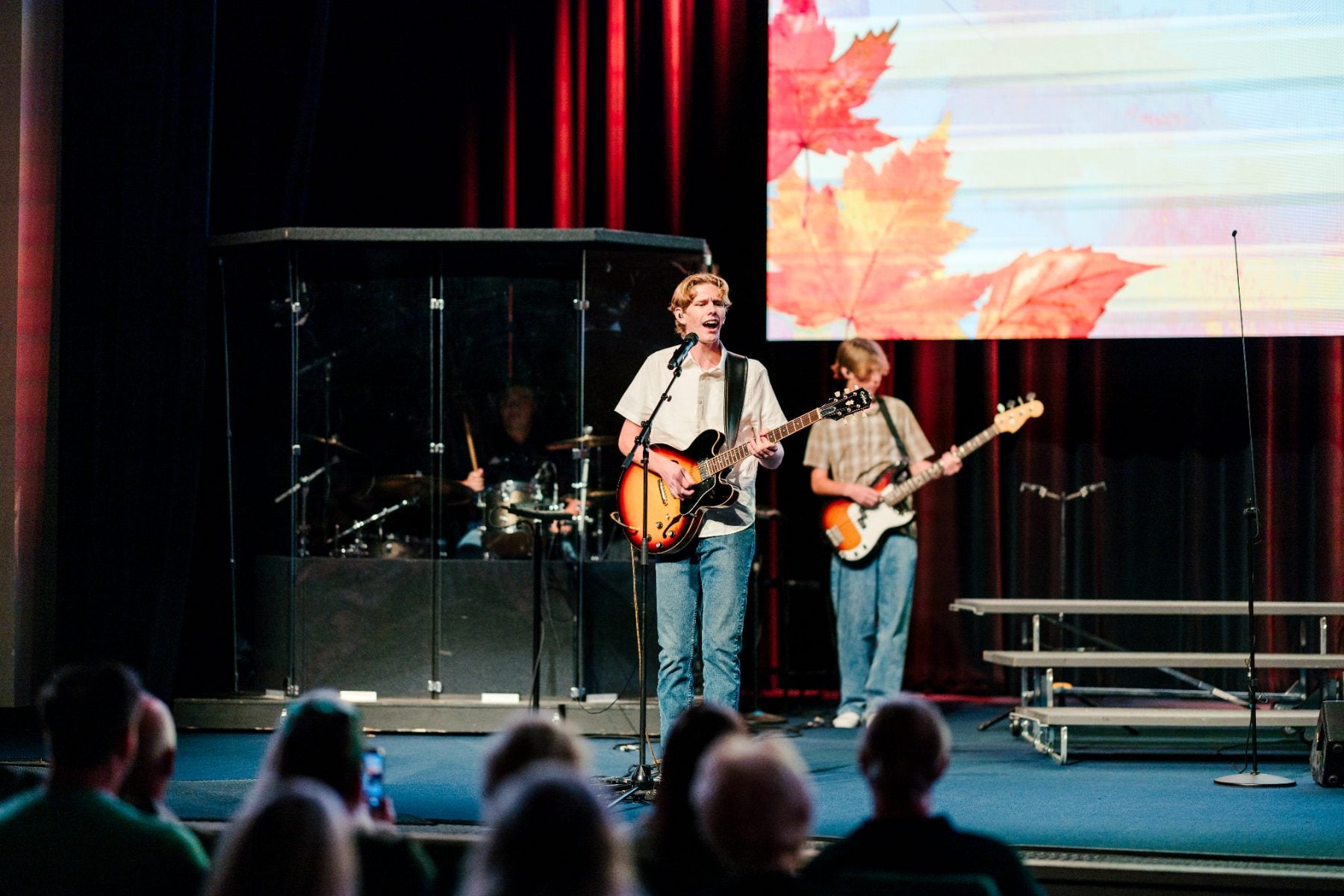 Student band performs with guitar and drums at the Fall Choral Concert, Event Center